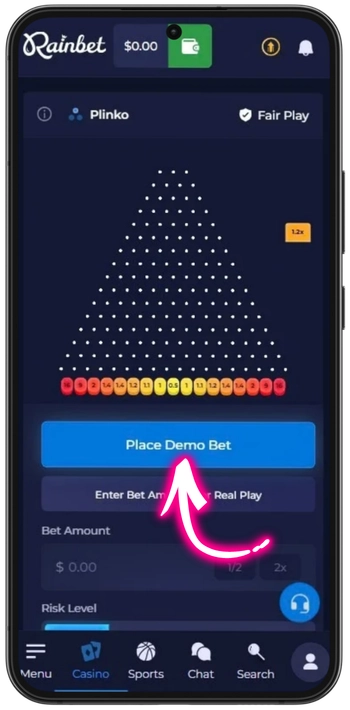 Rainbet Plinko ball dropping through pins